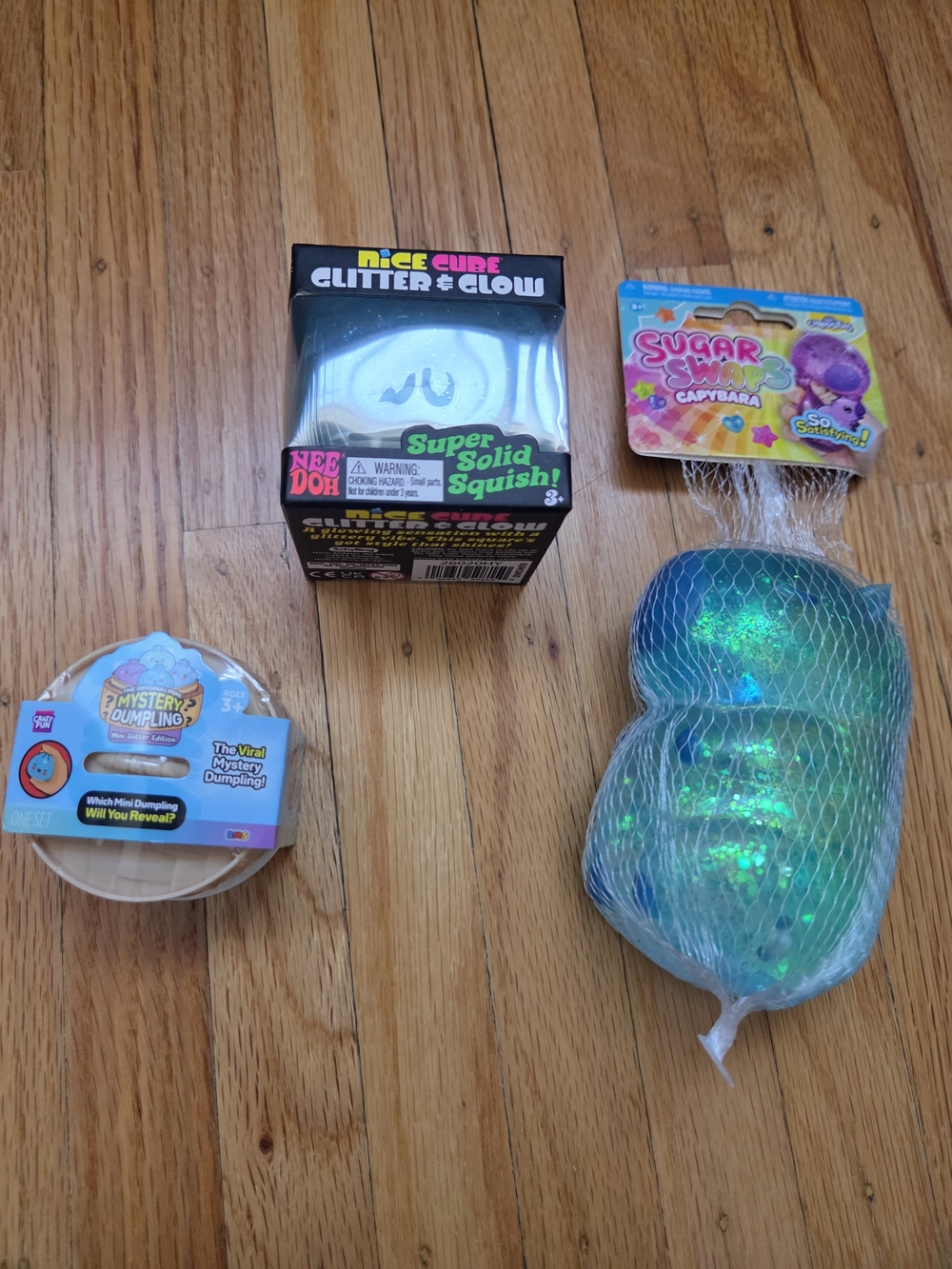 1 Blue Glow in the dark Needoh, 1 Mini RMS dumpling and 1 blue Capybara squishy.
